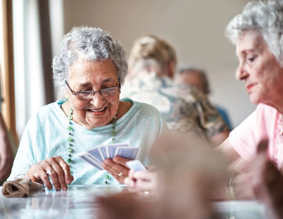 senior woman playing cards